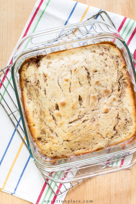 Make this easy cinnamon roll cake recipe for breakfast or brunch. It uses basic pantry ingredients and is ready to eat in under an hour! cinnamon roll cake before glaze