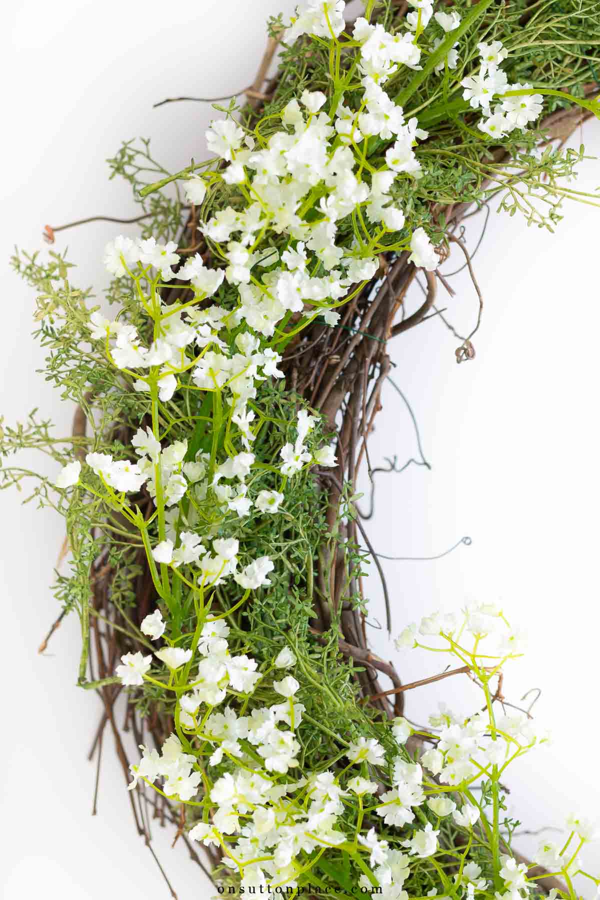 how to make a wreath add greenery and flowers