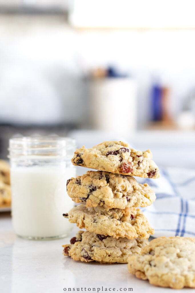 stack of cookies with glass of milk