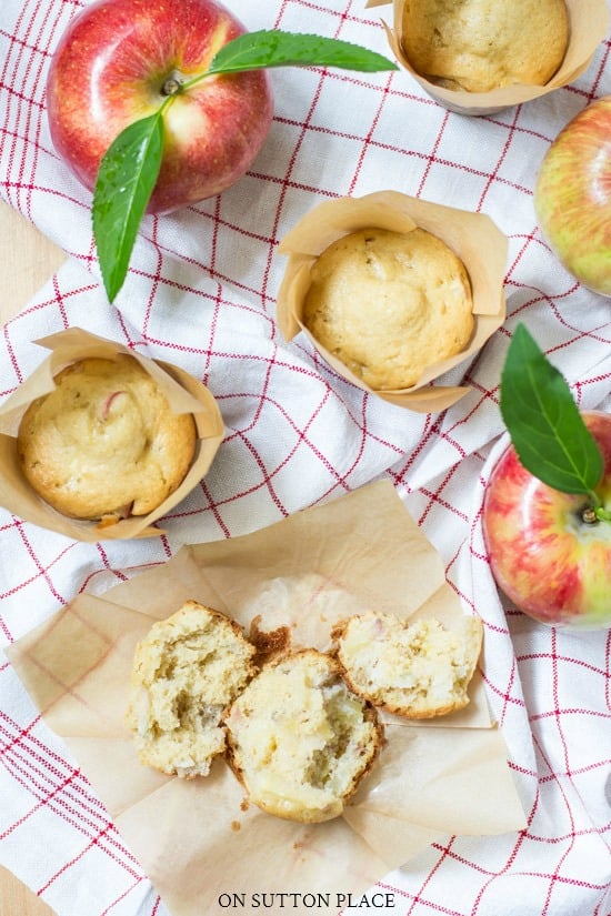 apple breakfast muffins in tulip wrappers on red plaid towel