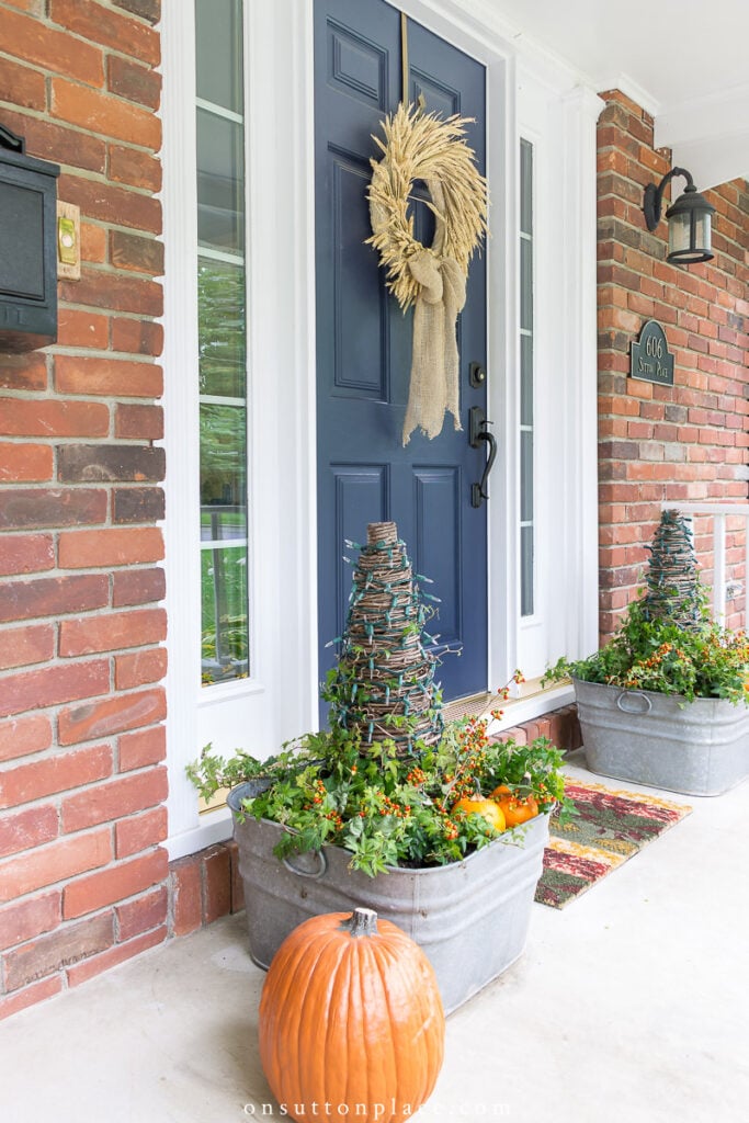 fall front porch with galvanized washtub planters 2022