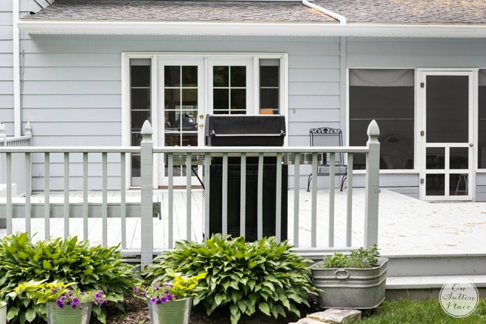 On Sutton Place | The Back | Simple update for a wood deck that includes stain, a railing fix and new accessories. DIY and affordable.