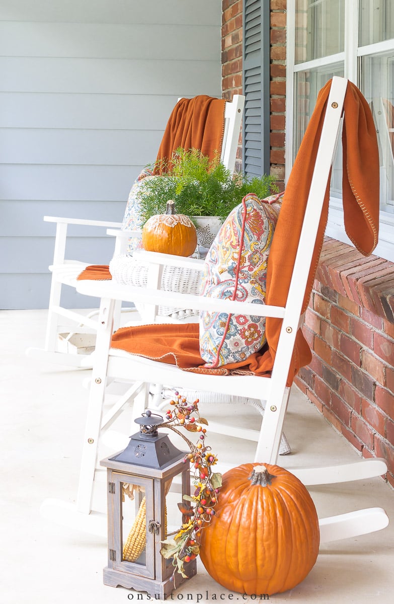 2022 white rockers on fall front porch