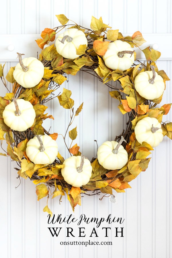 Fall White Pumpkin Wreath Tutorial. A super easy and inexpensive wreath idea to bring a touch of Autumn to your front door! #fall #fallwreath #falldecor #falldecorideas #whitepumpkins #fallleaves