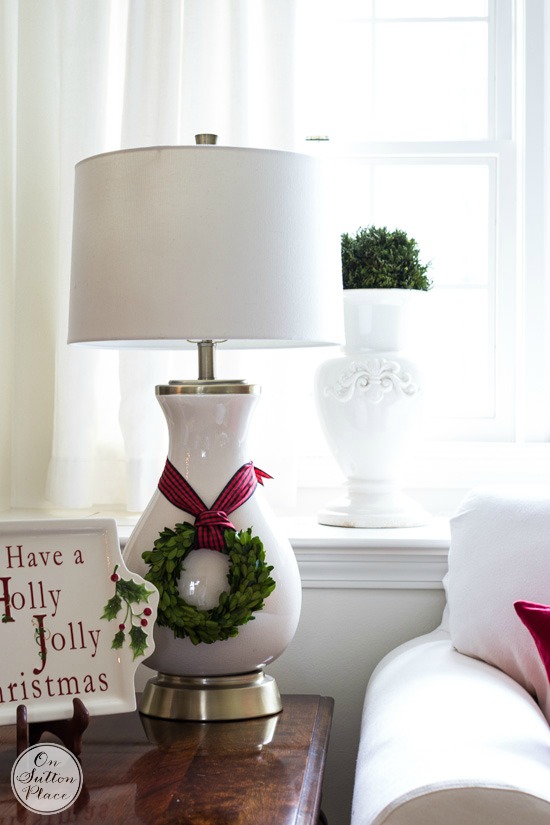 Easy Christmas Decorating Ideas | Festive, Fun & Fast | DIY inspiration for decorating your home for the holidays on a budget. Mini boxwood wreath tied with ribbon.