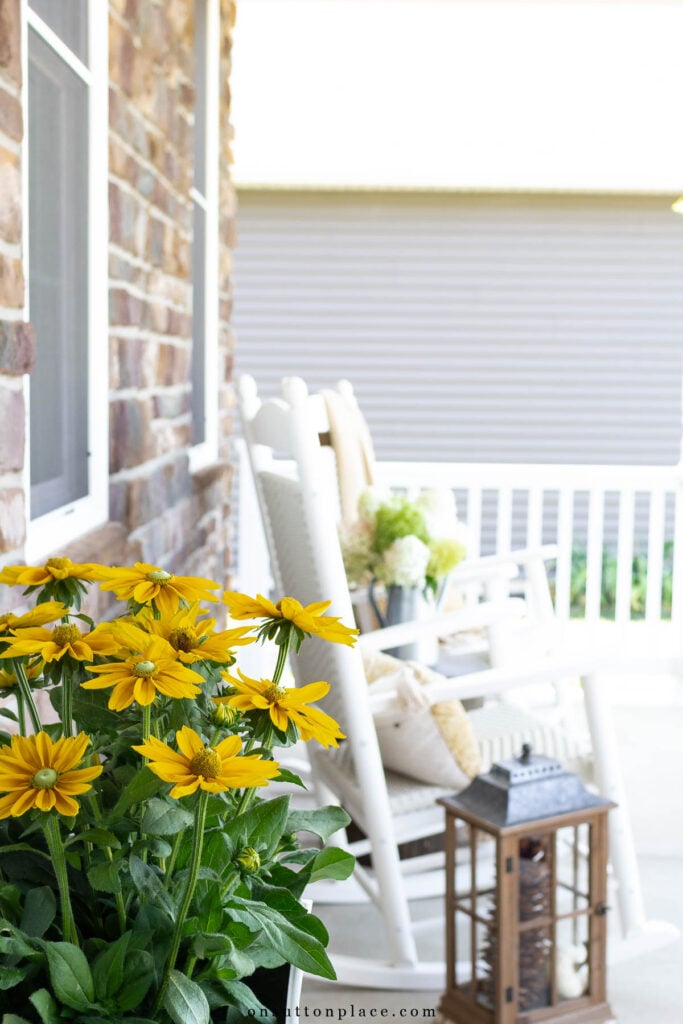fall porch decor with rockers white railing 2024