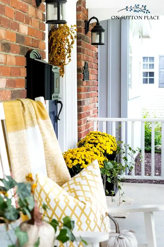 fall front porch with rockers and planters