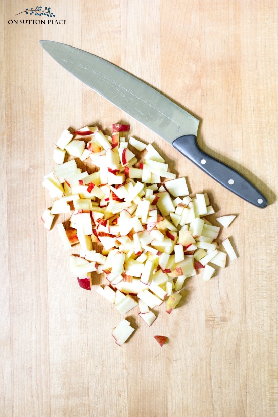 finely chopped apples on cutting board with knife