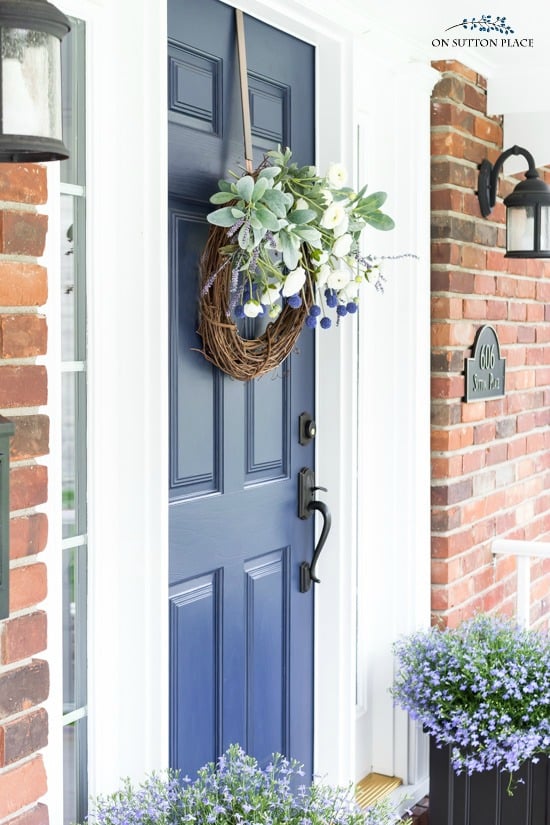 summer's eve grapevine wreath on blue front door