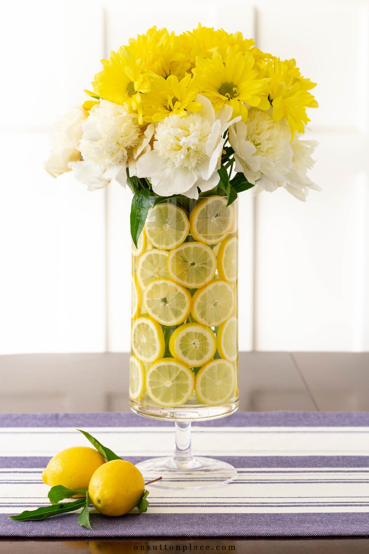 centerpiece with lemons yellow and white flowers