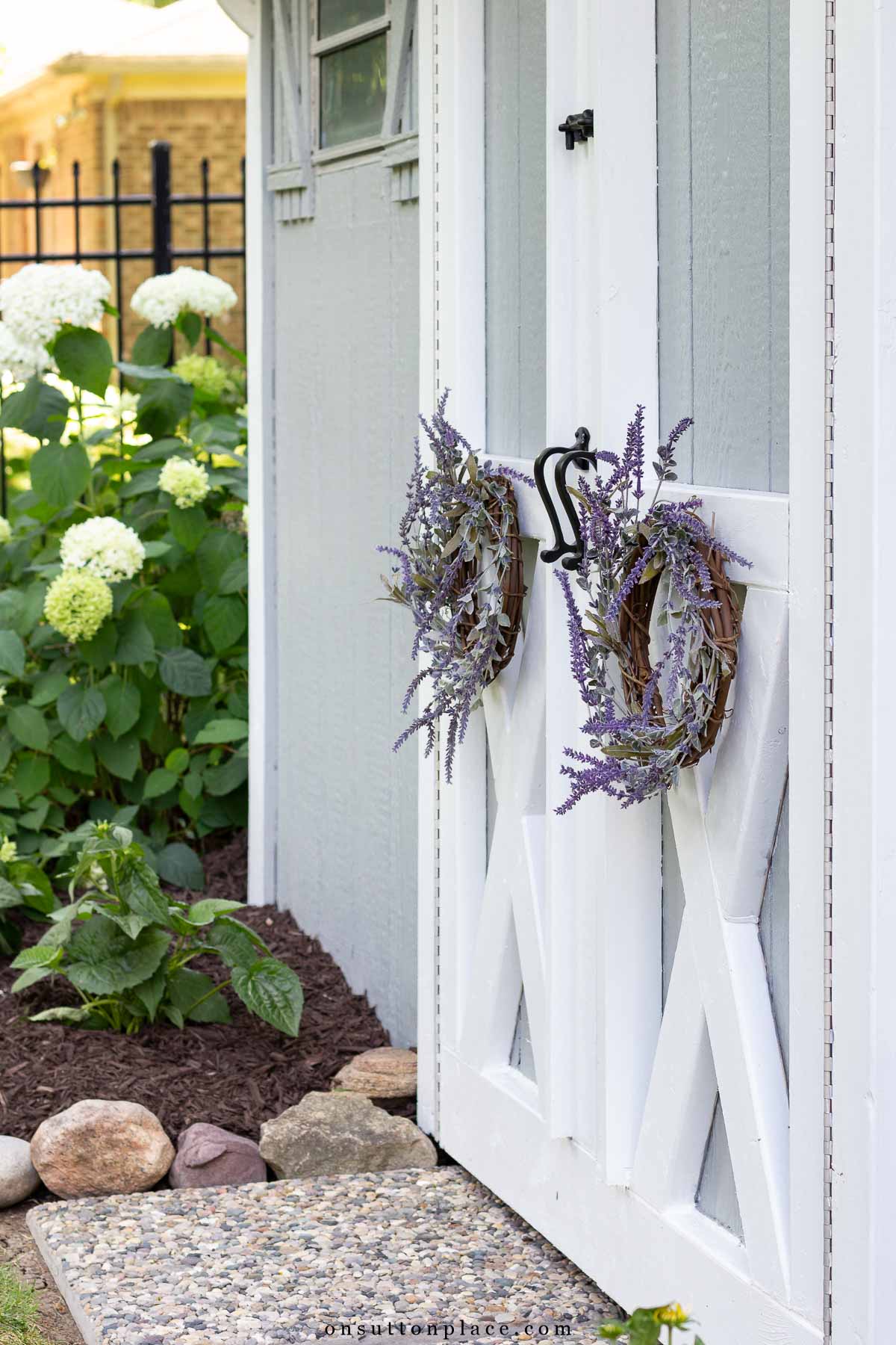 lavender wreaths on outdoor storage shed 2025