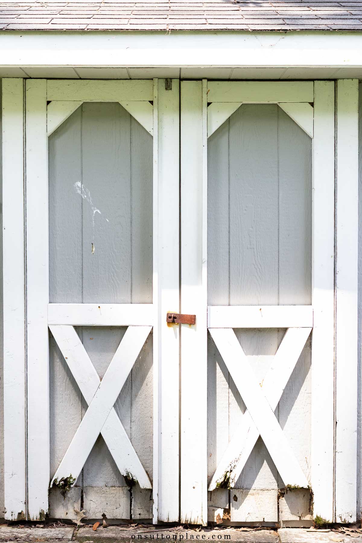 outdoor storage shed with rotting doors