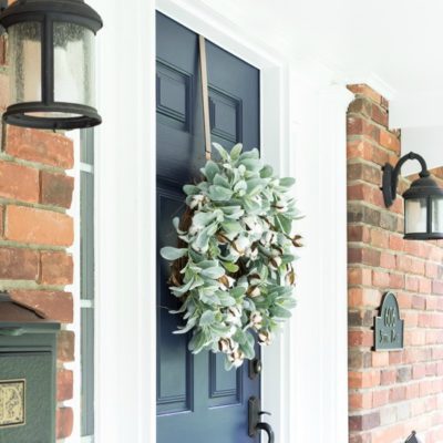 navy blue front door with fall wreath