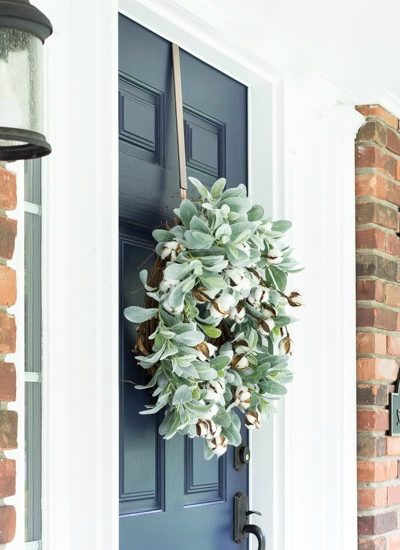 navy blue front door with fall wreath