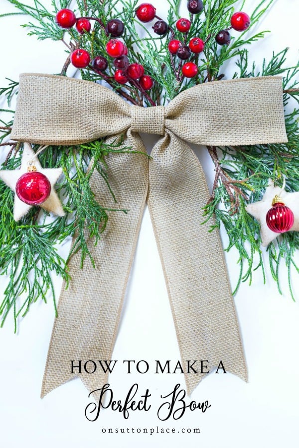 burlap bow with greenery red berries with text