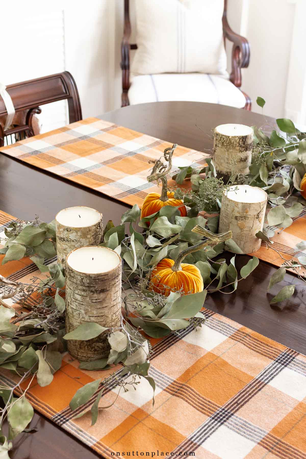 diy eucalyptus garland with candles and pumpkins