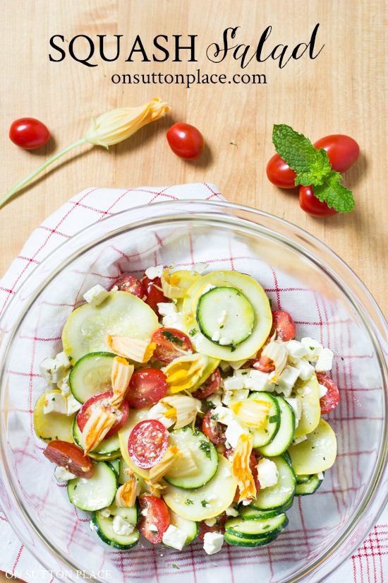 A delicious squash blossom recipe that calls for zucchini, squash, tomatoes, feta, and of couse, squash blossoms! It's the perfect summer side dish. #recipe #summer #salad #saladrecipe #squash #squashblossom #squashblossoms #squashblossomrecipe #squashsalad #recipeoftheday