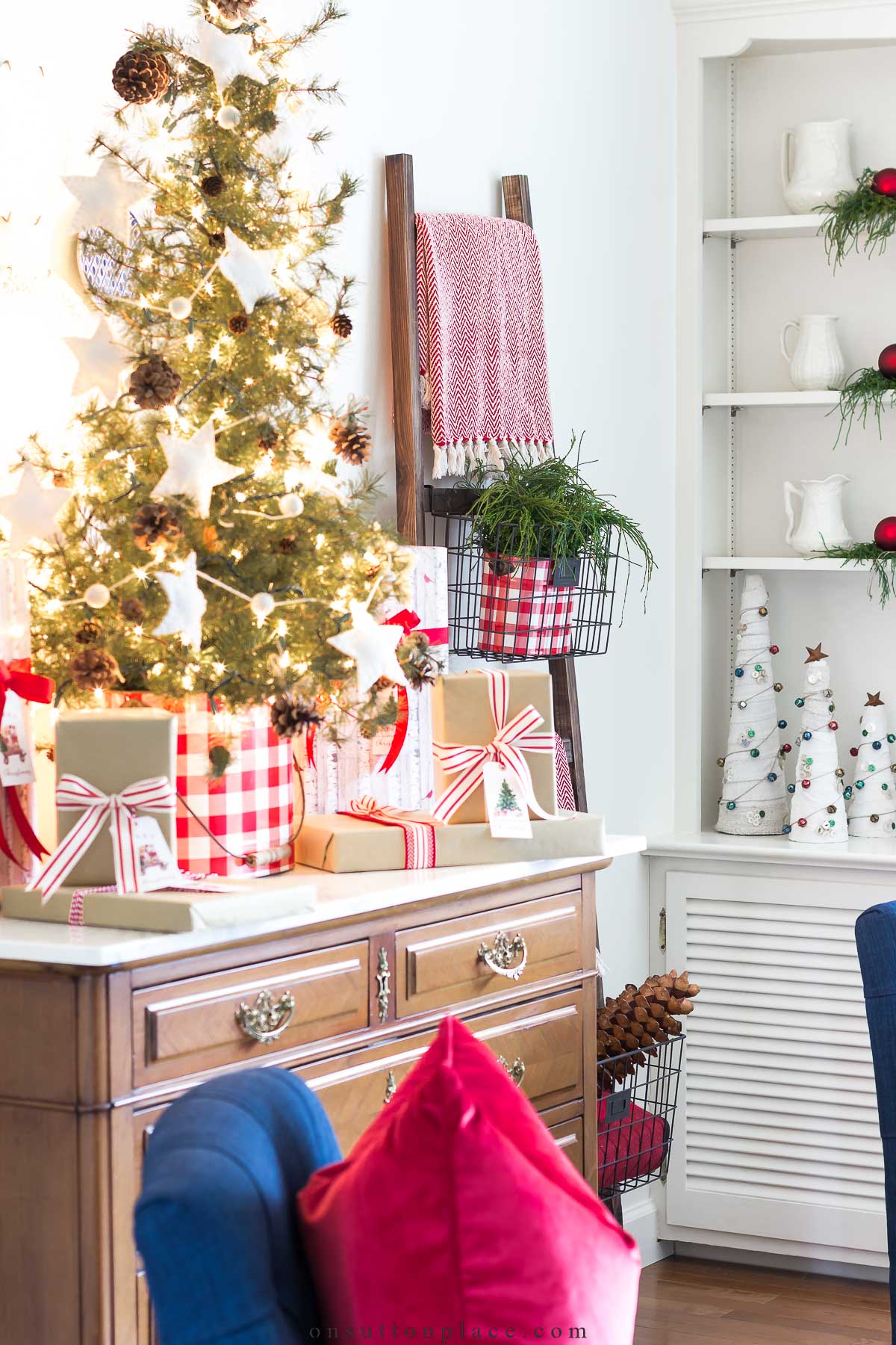 tabletop tree with christmas tree garland in living room