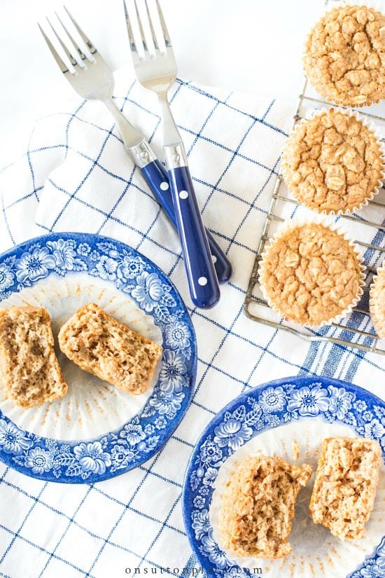 Make this healthy applesauce muffins recipe for a delicious on-the-go breakfast or an easy snack. No white sugar, no white flour, no butter or oil! applesauce muffins on plates with forks1
