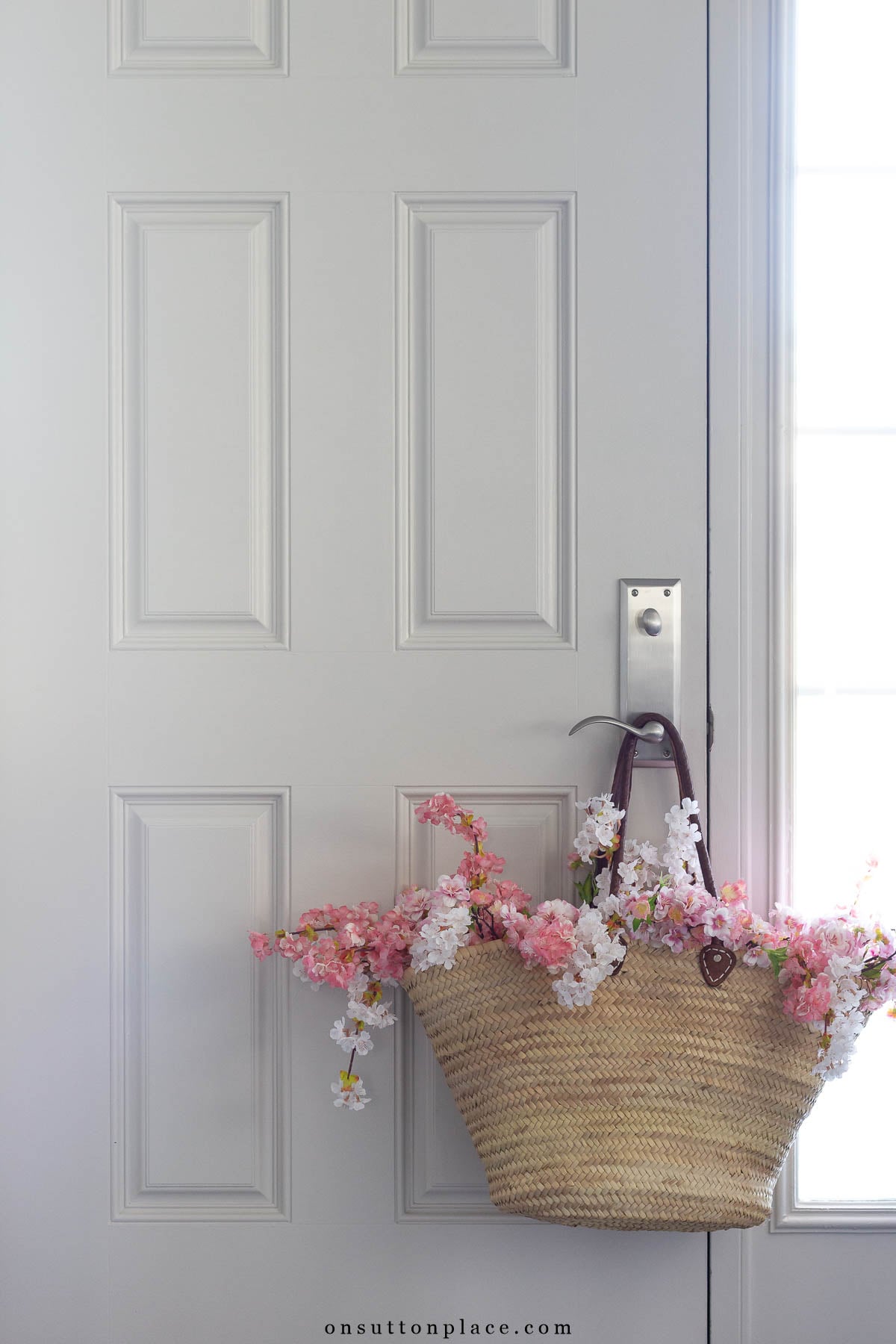 decorating with baskets market basket on door knob cherry blossoms