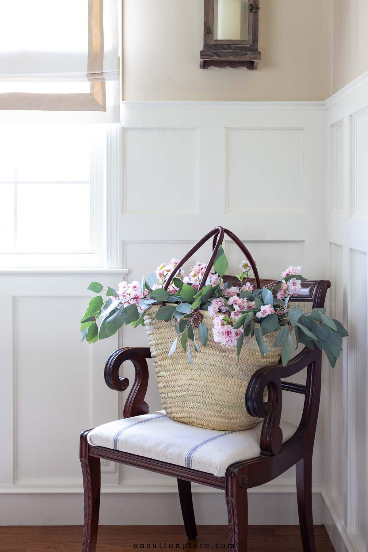 decorating with baskets market basket on vintage chair