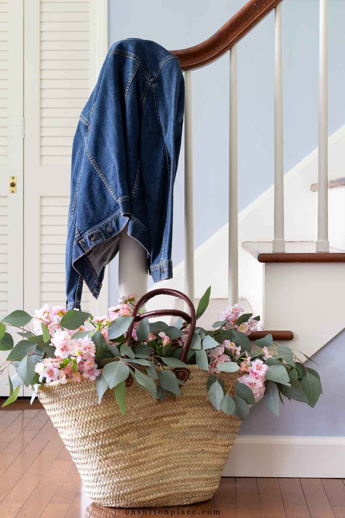 decorating with baskets market basket with cherry blossoms by stairway