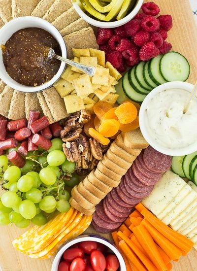 charcuterie board with fruits meats fi