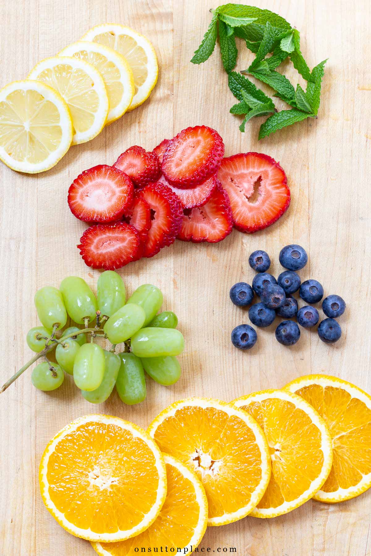 Make this non alcoholic white sangria recipe for your summer gatherings. Fresh fruit and tasty mint add just the right amount of flavor. So delicious! fruit for non alcoholic white sangria recipe