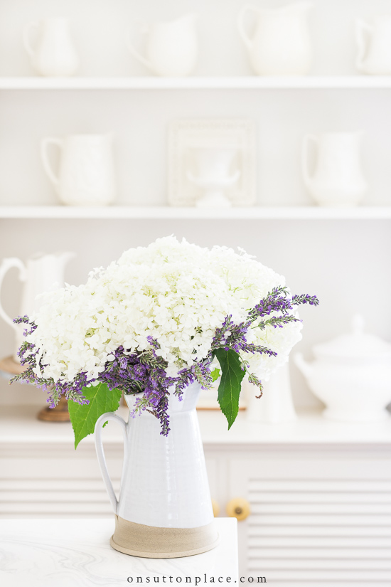 hydrangeas and lavender in stone pitcher