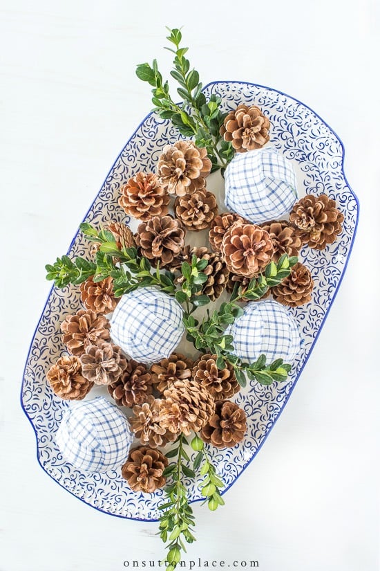 pine cone rag balls boxwood on platter