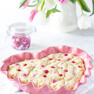 homemade cookie cake in heart dish pink m&ms