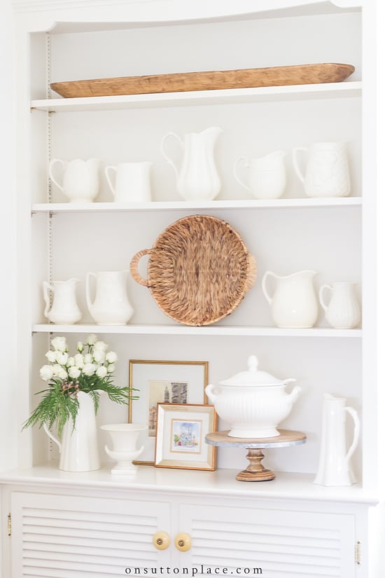 how to decorate shelves neutral pitchers