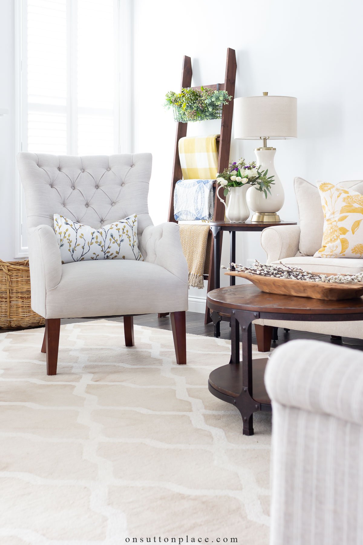 spring decor idea neutral living room with yellow accents