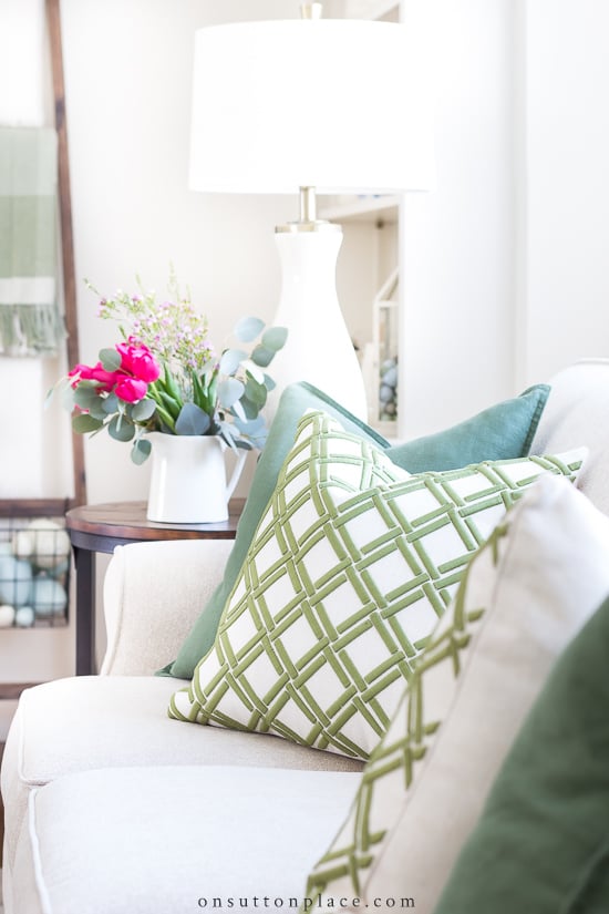 spring pillows on white sofa