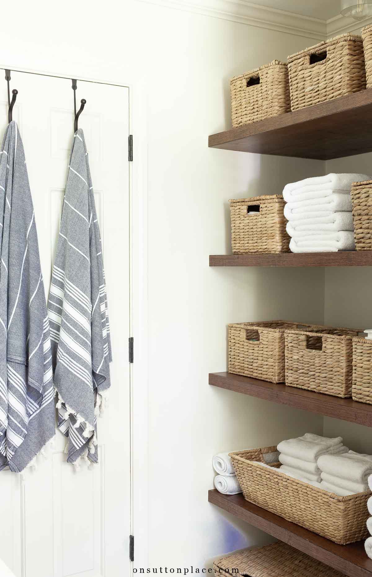 small bathroom remodel baskets on shelves for storage linen closet