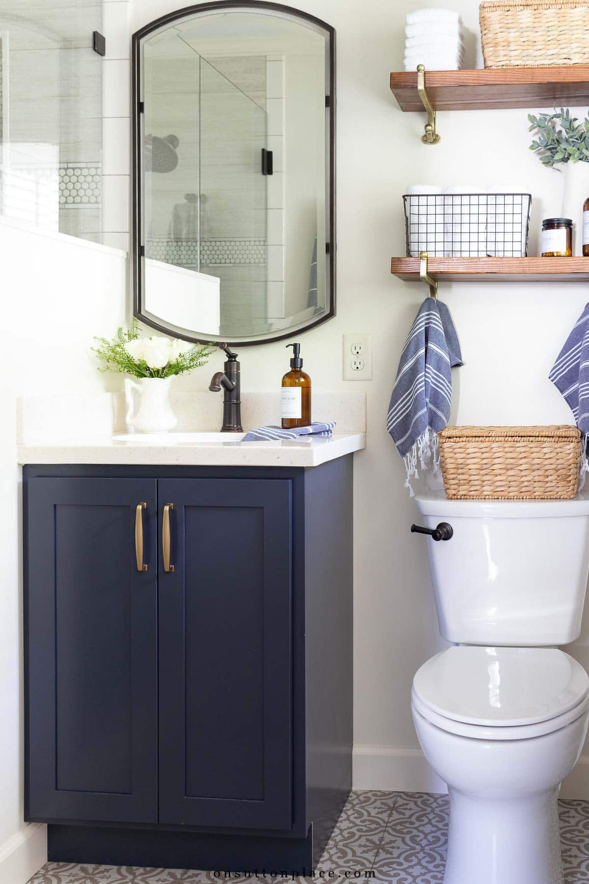 small primary bathroom remodel navy blue vanity oil rubbed bronze fixures