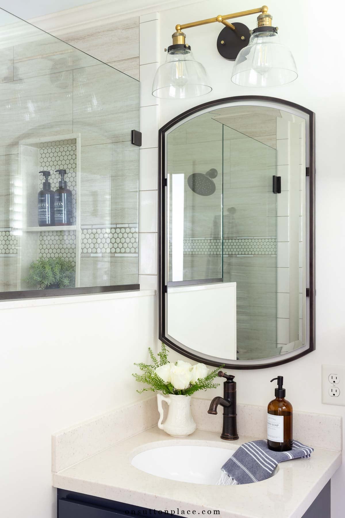 small primary bathroom remodel pony wall beside vanity