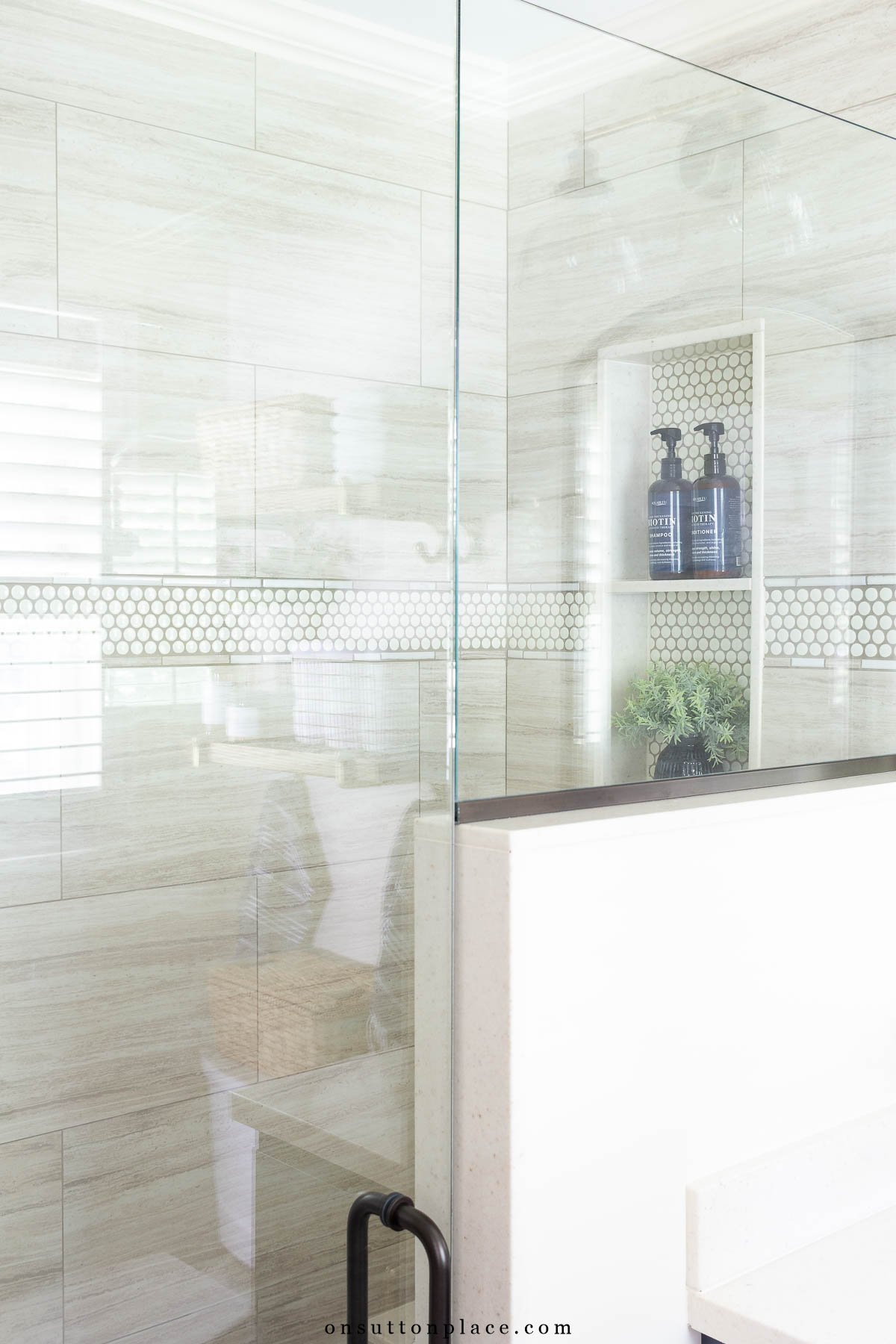 small primary bathroom remodel pony wall glass enclosure niche in shower