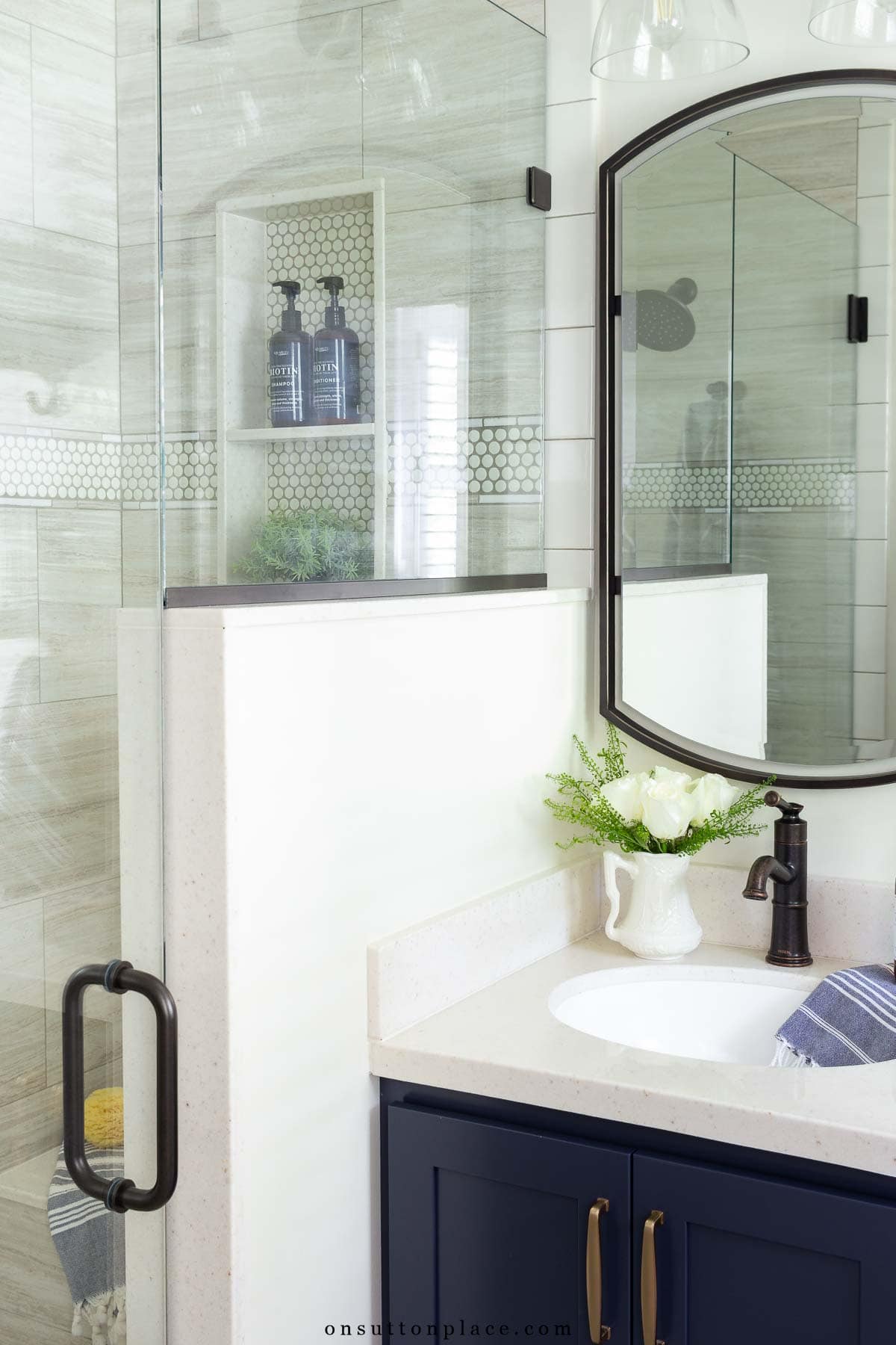 small primary bathroom remodel pony wall with glass enclosure