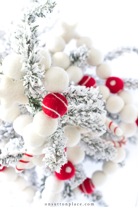 Make this DIY Christmas Garland from wool felt balls & trim the tree in style! An easy & quick Christmas craft for both adults and children.