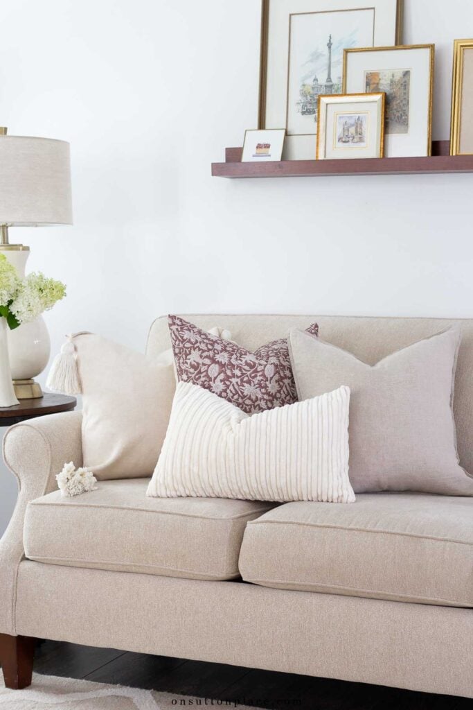 neutral pillows arranged on sofa