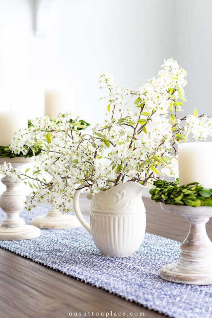 serviceberry blooms in pitcher on table