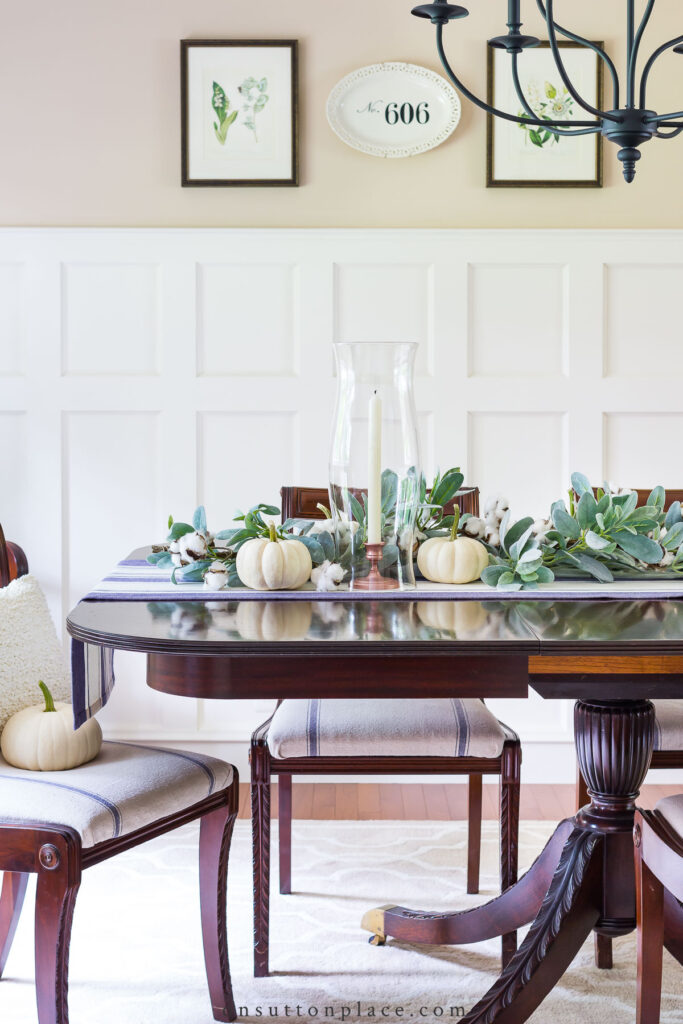 fall garland on dining table with striped runner 2022