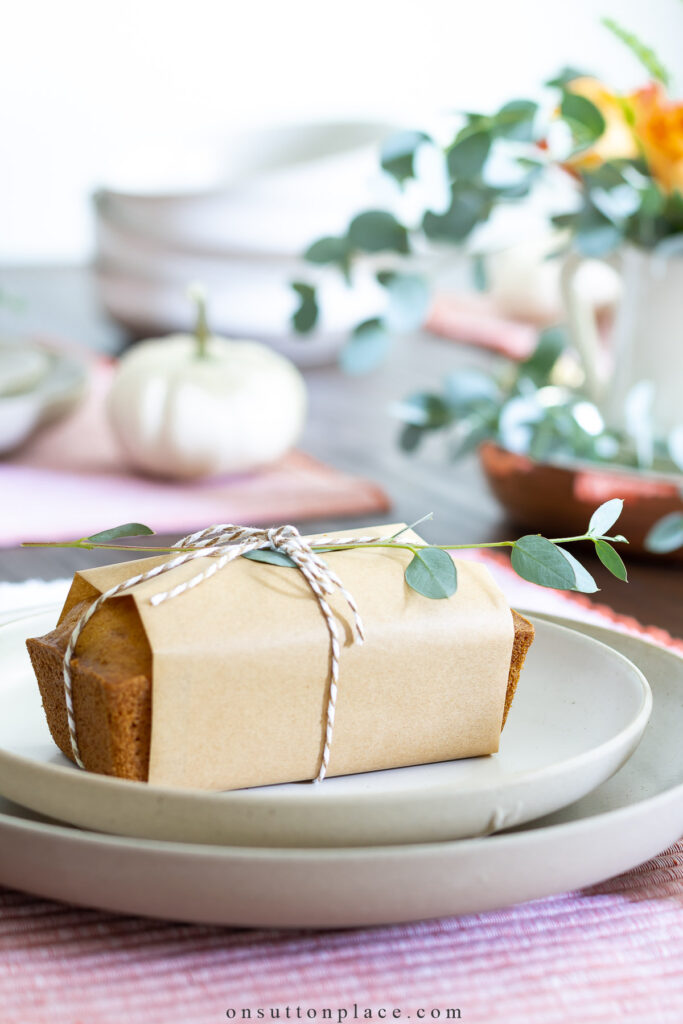 loaf of pumpkin bread on fall table setting 2022