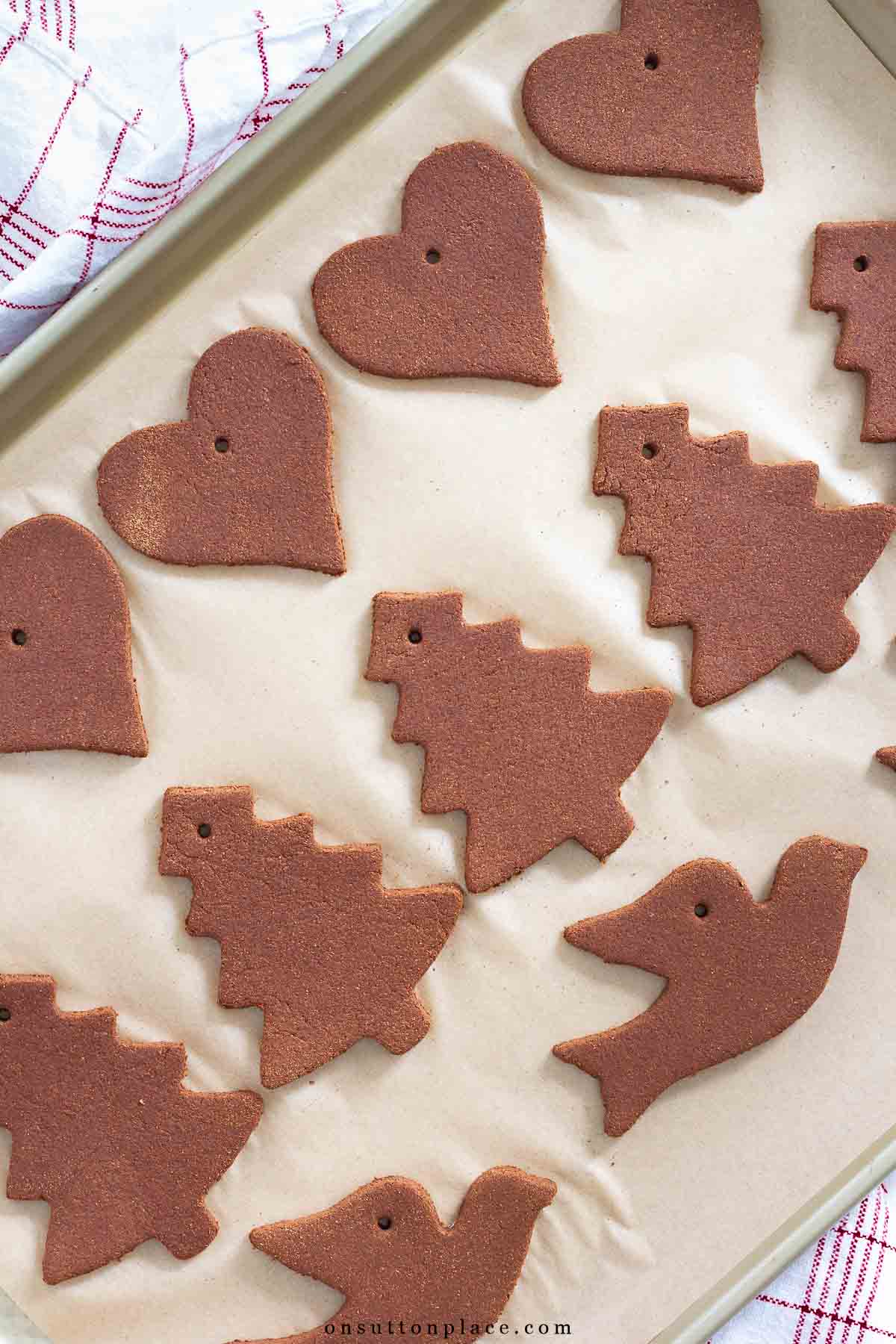 cinnamon ornaments drying on baking sheet