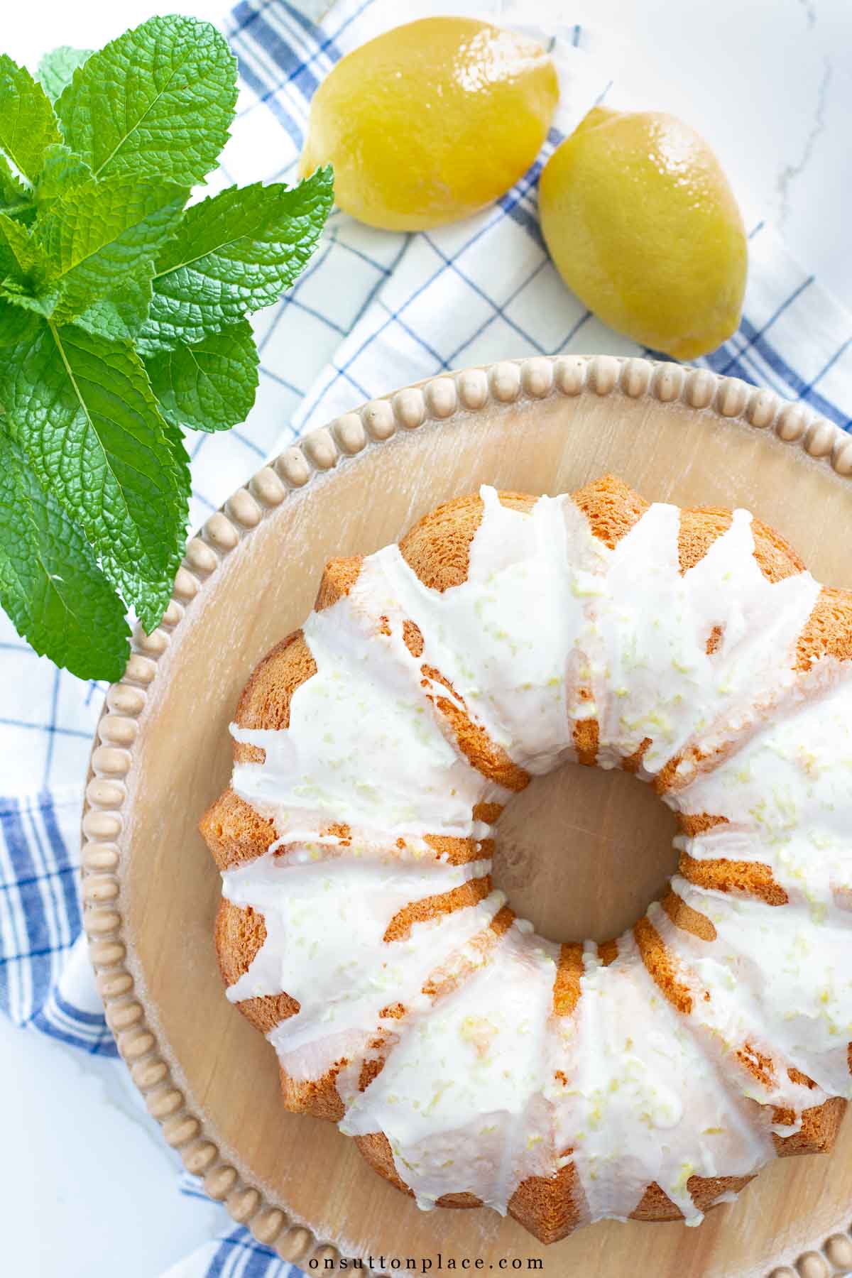 box cake mix tips lemon bundt cake on wood pedestal plate