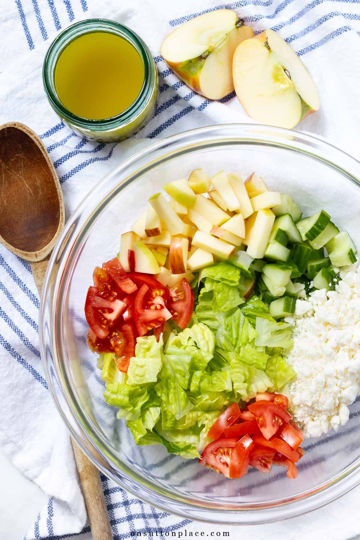 romaine salad recipe with apples and feta in bowl