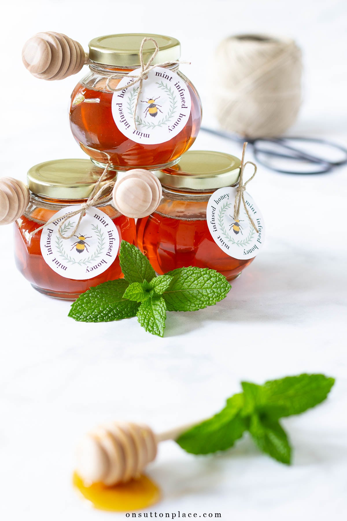 jars of mint infused honey with gift tags