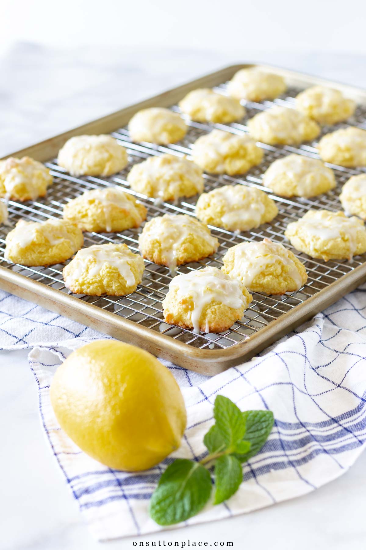 lemon cookies recipe with glaze on baking sheet