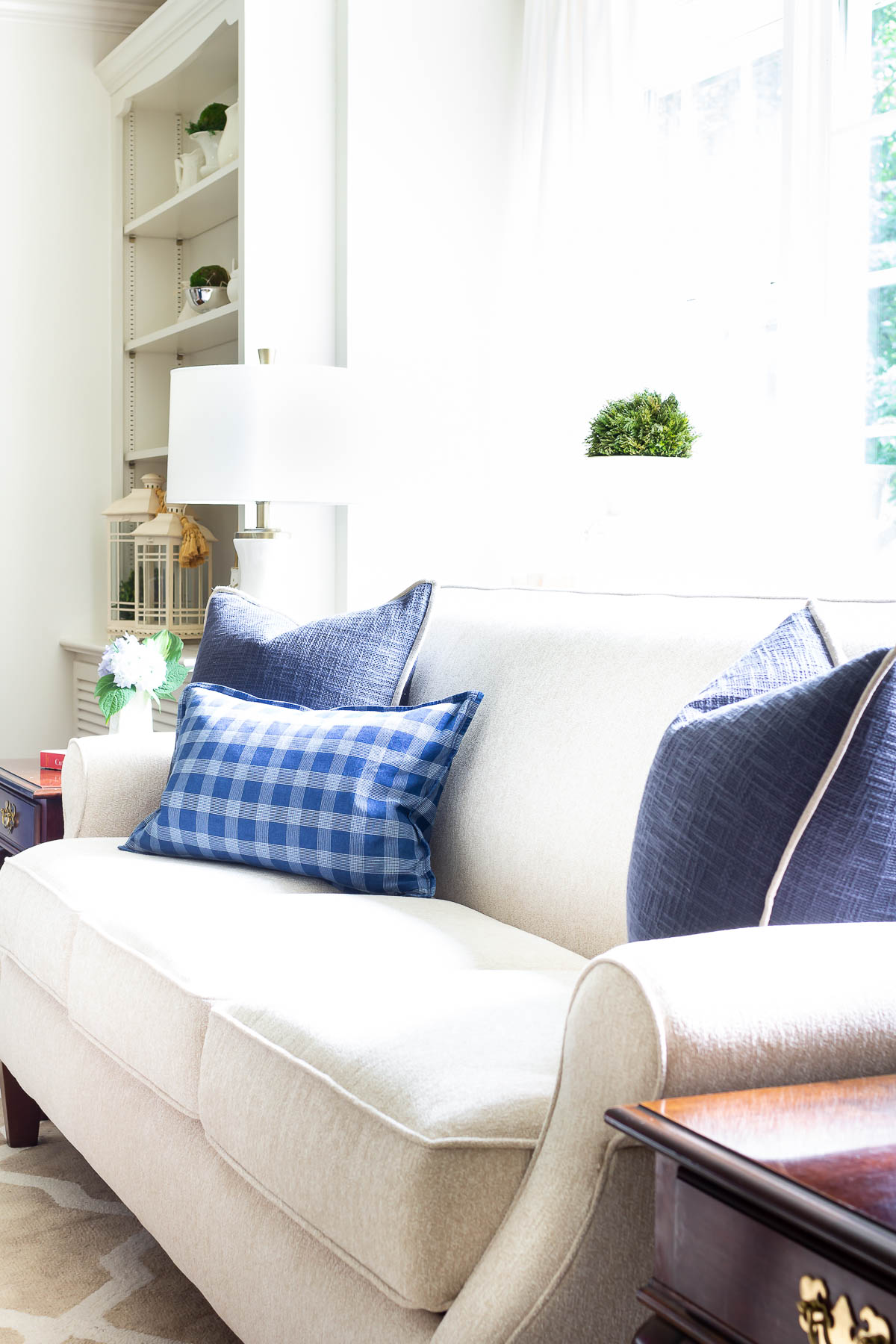 navy pillows on neutral sofa farmhouse pillows post